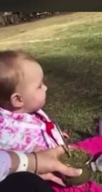 baby drinking some tea