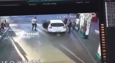 A group of Palestinians are arrested by Israeli police at a petrol pump
