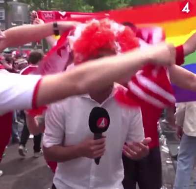Danish fans interrupt swedish reporter live on television