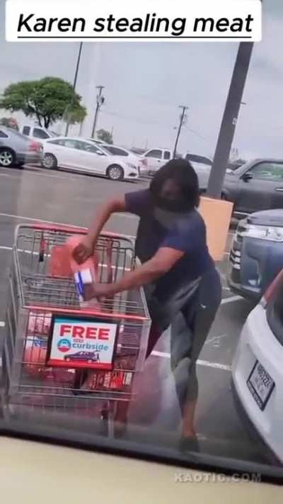 Woman steals meat in a parking lot