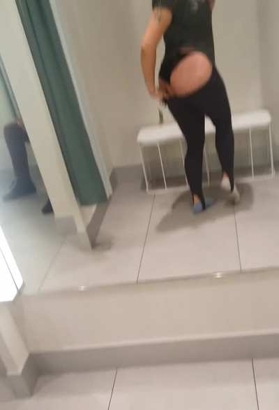 There's a girl sitting next to me in the fitting room, her boyfriend across from her, sometimes security will look in, and I'm showing and recording my butt and being a little horny. [GIF]