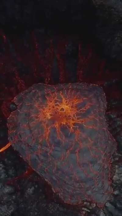 a drone hovering over an active volcano