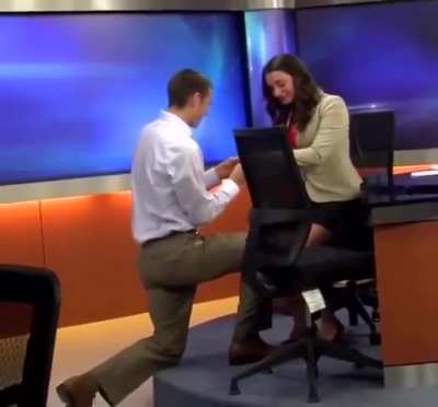 News anchor unintentionally introduces boyfriend's proposal during live newscast.