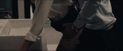 Charlize Theron getting clapped in Gringo