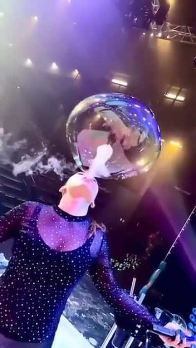 Blowing bubbles into a bubble