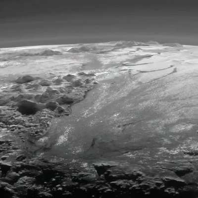 Pluto&rsquo;s ice mountains: Frozen plains and layers of atmospheric haze backlit by a distant sun, as seen by the New Horizons spacecraft. Credit: NASA/JHUAPL/SwRi