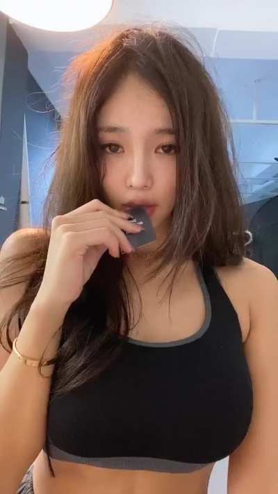 Opening with her teeth