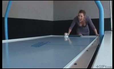 Playing air hockey