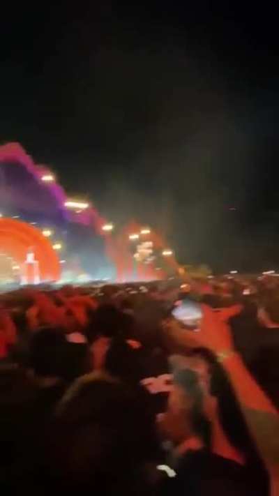 Fans in the back chant "Stop the show" because hundreds were crushed and injured, and 11 died, while Travis Scott was performing at the Astrofest concert