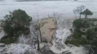 This time last year on the Sunshine Coast we had bushfires... Now we have this. The king tide at Bribie Island has pushed through the island and broken through.