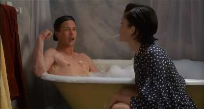 Lara Flynn Boyle Squeezes a Guy&rsquo;s Balls in Threesome (1994)