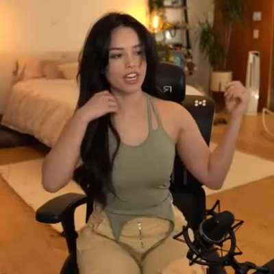 Adjusting her bra