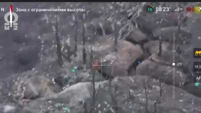 Kamikaze FPV drone pilot flies around a dugout to find the best point of entry