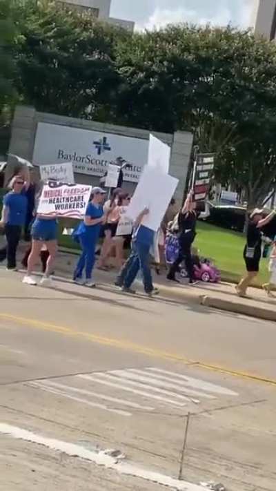 Anti-vaccine protestors marching outside a hospital in Texas, chanting &ldquo;my body my choice!&rdquo;