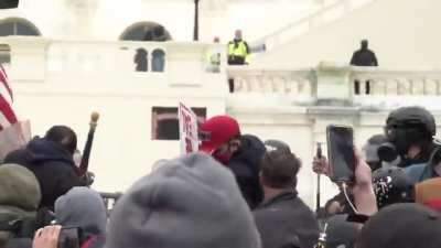 #SuitMacer unmasked. He sprayed some kind of pepper spray on many police officers.