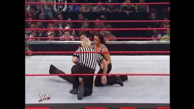 Molly Holly chokes out Trish with her own sweater!