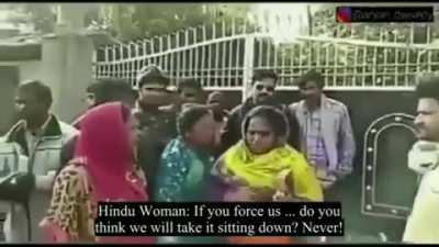 Fascist Abuse...! A Hindutvadi woman known as Maa (Mother) comes across some Christian women going to Church. She stops them and starts abusing and harassing them and forcing them to put the Bible on the floor so she can step and spit on it. This is every