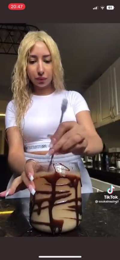 Why is the chocolate on the outside? Why is she making it so fast? Why does she look like she&rsquo;s being held against her will??