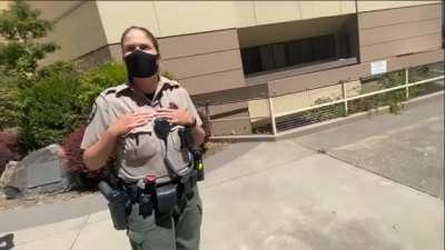 Shameful behavior: Female officer doesn't want her name and badge on the chest of her uniform filmed, so she accuses guy of filming her boobs
