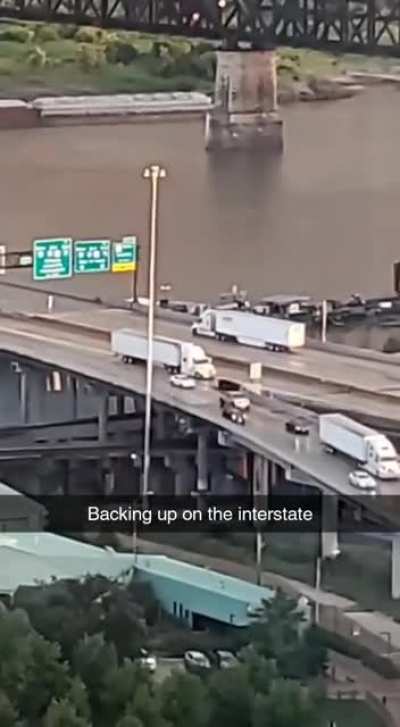 Semi backing up on an interstate