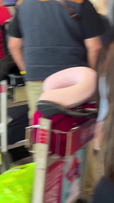 Irate man smashing up airport with a hammer