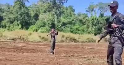 Myanmar soldier plays with an RPG