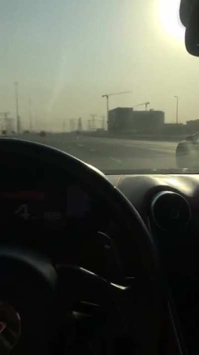 Filming a super car race with one hand on the wheel at 277kmh