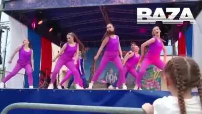 Performers fall off stage