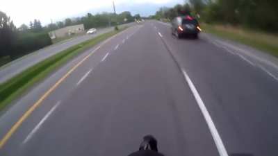 Biker films himself committing numerous illegal driving offenses, gets enraged someone made a legal and completely safe left turn in front of him, follows the driver home and knocks him out