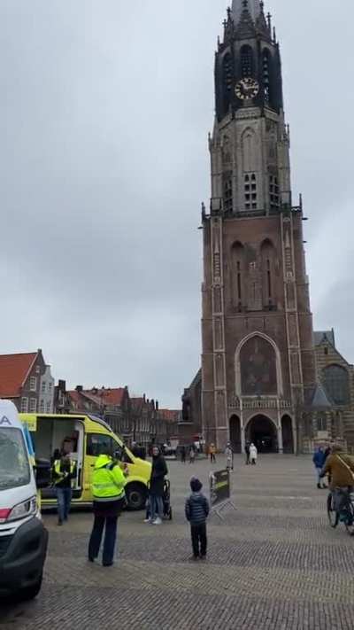 A clock tower in Delft NL plays Ukrainian national anthem in front of a destroyed ambulance from Kharkiv area that is exhibited in the city &hearts;️🤍💙