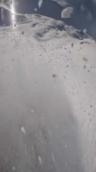 Skiing down this mountain ridge