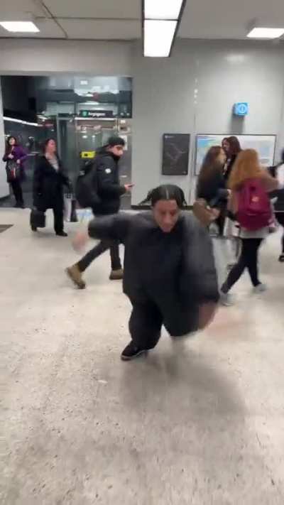 Absolute unit of an idiot getting in the way of everyone in the metro