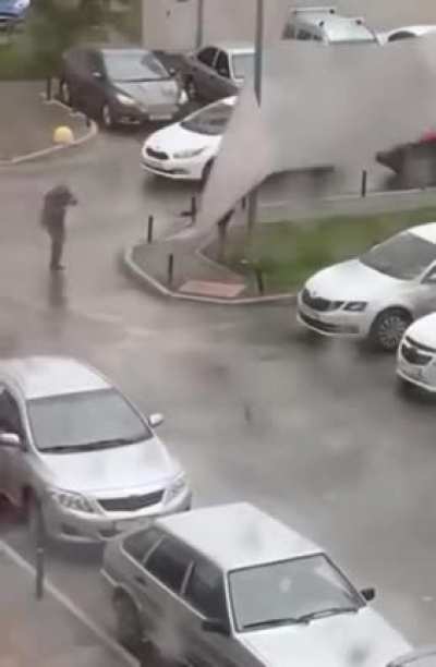 Walking on a metal sheet on a windy day