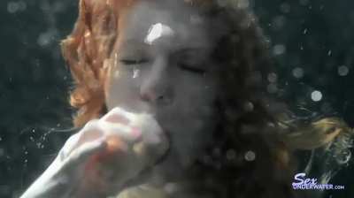 Paige Turner blows very sensual bubbles while sucking a dildo