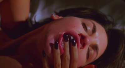 GF Jennifer Tilly is in love with her neighbor Gina Gershon, making grocery excuses and even involving BF's boss to get some free time for a lesbian finger bang session in Bound (1996)