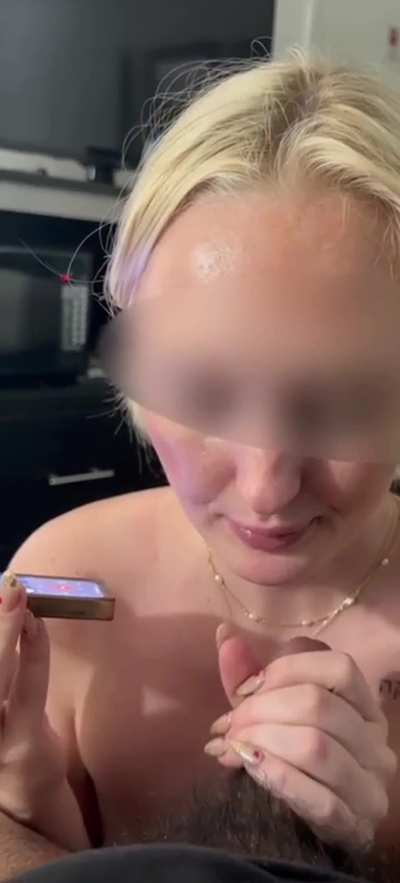White Girl talking with BF on the phone while sucking Brown Cock
