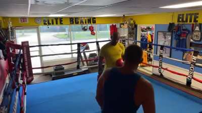 Going to a boxing gym and challenging the coach