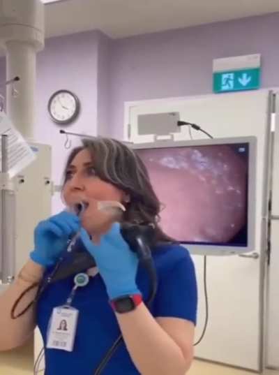 This nurse demonstrates an endoscopy on herself. Wtf