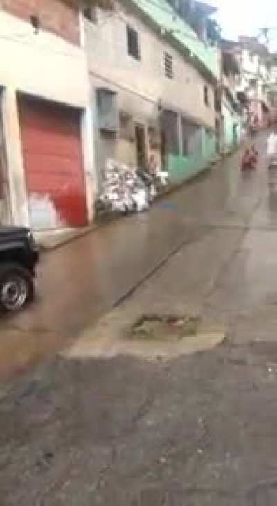sliding down a hill during heavy rain