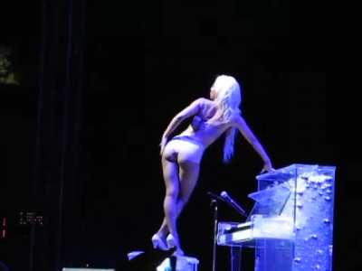Lady Gaga doing some sus gestures on stage