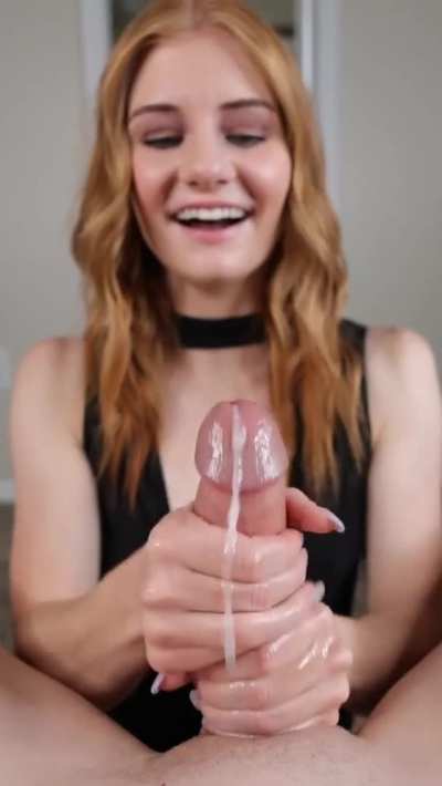 Cute Redhead smiling while she strokes him
