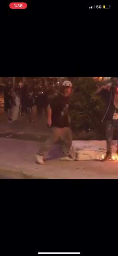 Protesters burn homeless man’s possessions and mattress