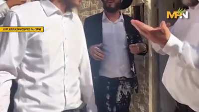 Israeli settler stealing a Palestinian’s home, and tried to hand the man his own milk
