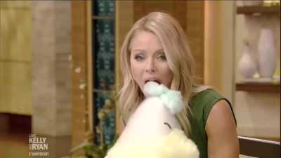 Kelly licking some cotton candy!