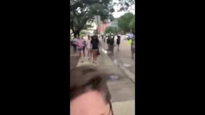 Black supremacists assault and forcefully remove White people from "peaceful" protest, then smash one of their phones.