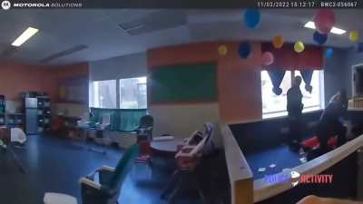 A fleeing suspect runs in to a open door of a daycare.