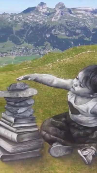 Artist Guillaume Legros paints on grass and mostly on hill &amp;amp; mountain sides: he has to wait for sunny days, but when this happens, slopes become immense artworks. And his paint is safe for the environment. Credit: @Rainmaker1973 Twitter