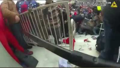 Police being dragged into the mob by terrorists during the January 6th insurrection