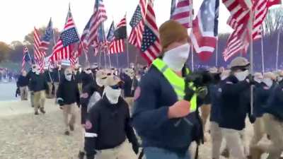 MAGA Nazis marching through Washington DC with signs that say "Reclaim America" and "Victory or Death"
