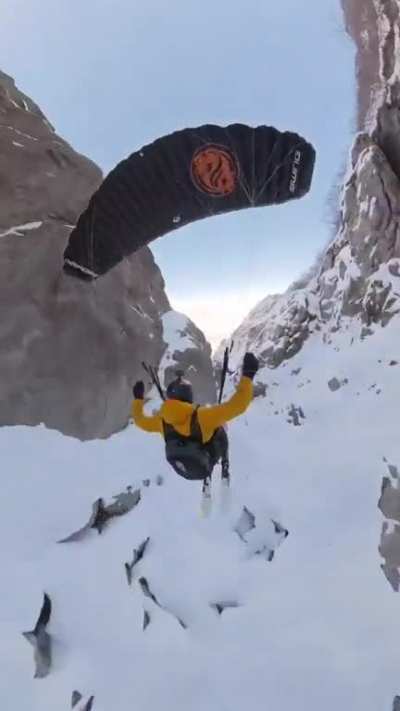 Paragliding through cliffs